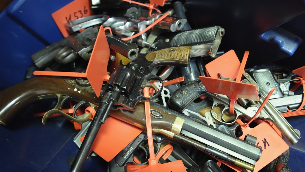 Tagged handguns lay in a bucket during a gun buyback program on March 9, 2013 in Keansburg, New Jersey.  (Photo by Michael Loccisano/Getty Images)