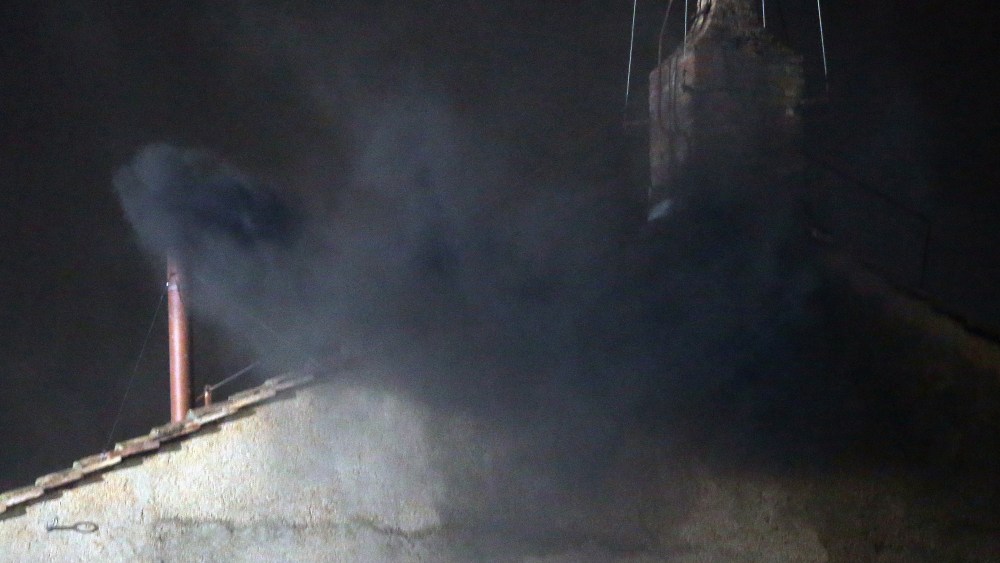 Black smoke billows out from a chimney on the roof of the Sistine Chapel indicating that the College of Cardinals have failed to elect a new Pope on March 12, 2013 in Vatican City, Vatican. Pope Benedict XVI's successor is being chosen by the College...