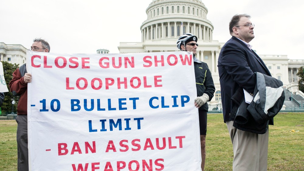 File Photo: Supporters with a group of 26 cyclists who rode from Newtown, Connecticut in support of common-sense solutions to gun violence hold up banners during a press conference with congress members from Connecticut on March 12, 2013 in Washington,...