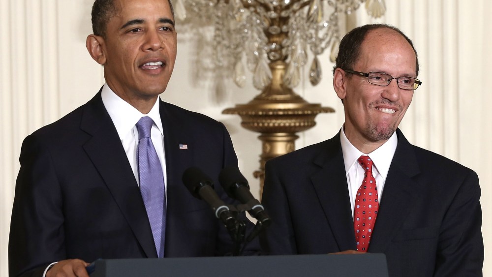 U.S. President Barack Obama (L) speaks as Assistant Attorney General of Justice Department's civil rights division Thomas Perez (R) listens during a personnel announcement March 18, 2013 at the East Room of the White House in Washington, DC. President...