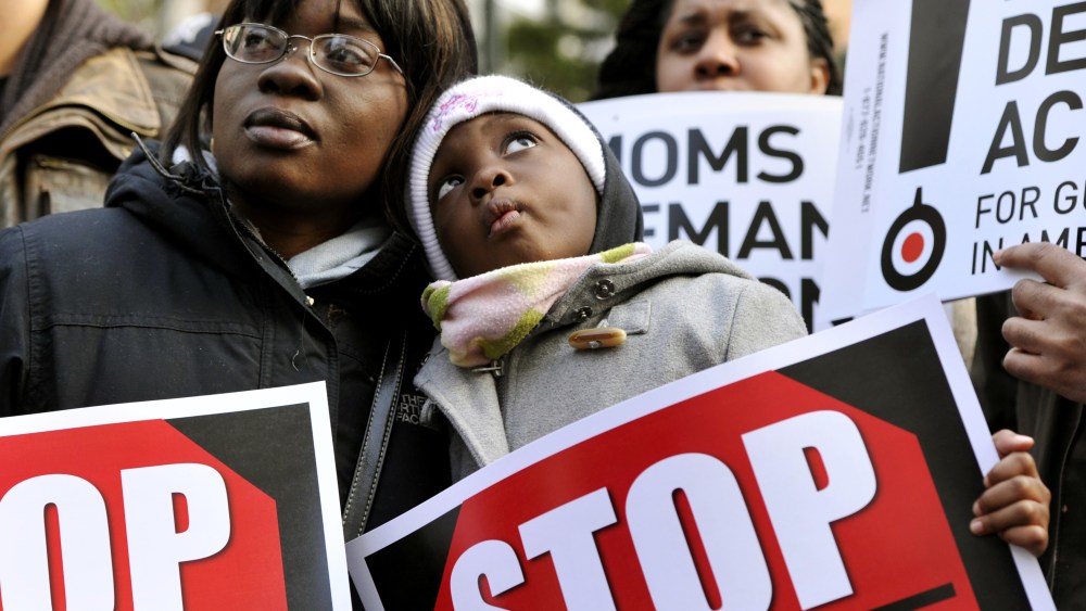 Demonstrators attend a rally and march to support federal and state gun control proposals on March 21, 2013 in the Harlem district of New York City.