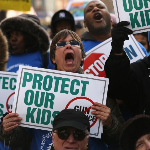 Demonstrators take part in a rally against gun violence on March 21, 2013 in the Harlem neighborhood of the Manhattan borough of New York City.