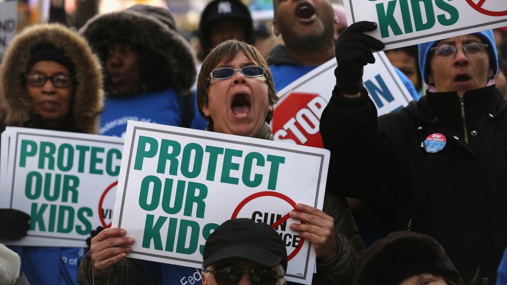 Demonstrators take part in a rally against gun violence on March 21, 2013 in the Harlem neighborhood of the Manhattan borough of New York City.