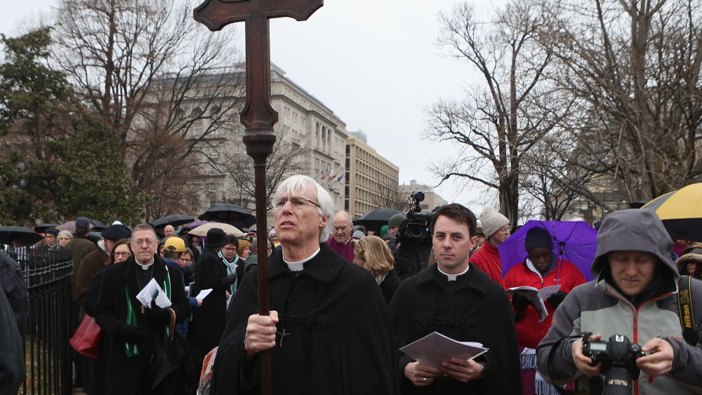 Episcopal bishops from throughout the church lead about 100 clergy and lay people in praying the Stations of the Cross as they processed from the White House to the U. S. Capitol March 25, 2013 in Washington, DC. The march was organized 'to challenge...