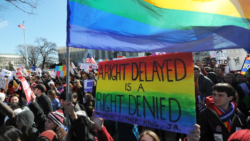 Same-sex marriage supporters shout slogans in front of the US Supreme Court on March 26, 2013 in Washington, DC. (Photo by Jewel Samad/AFP/Getty Images)