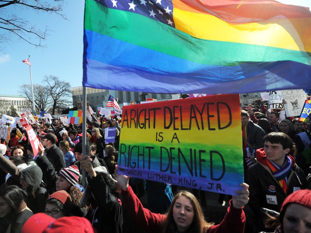 Same-sex marriage supporters shout slogans in front of the US Supreme Court on March 26, 2013 in Washington, DC. (Photo by Jewel Samad/AFP/Getty Images)