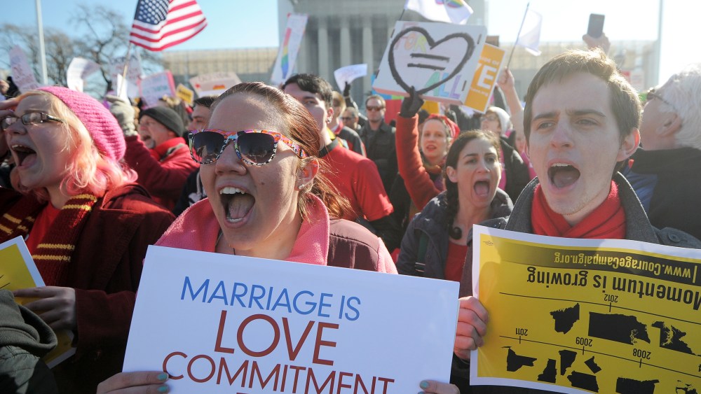 Same-sex marriage supporters shout slogans in front of the US Supreme Court on March 26, 2013 in Washington, DC. (Photo by Jewel Samad/AFP/Getty Images)
