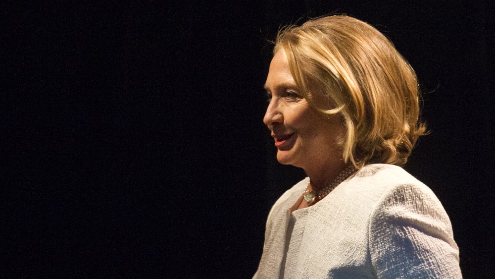 Former U.S. Sec. of State Hillary Clinton arrives on stage to address the Vital Voices Global Awards ceremony at the Kennedy Center in Washington on April 2, 2013. She will be a Democratic party nominee in 2016, David Axelrod said. (Photo by Nicholas...