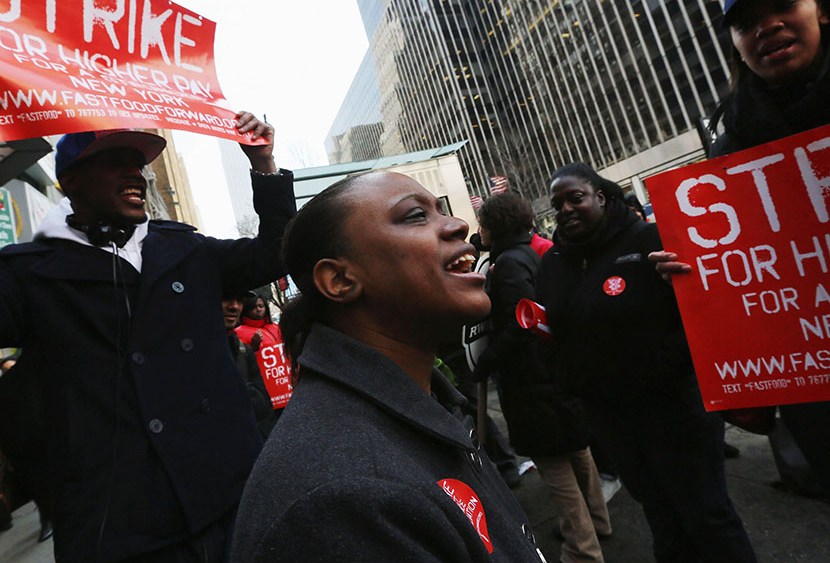Fast food workers and supporters protest for better wages outside a Wendy's restaurant in Manhattan on April 4, 2013 in New York City. (Photo by Mario Tama/Getty Images)