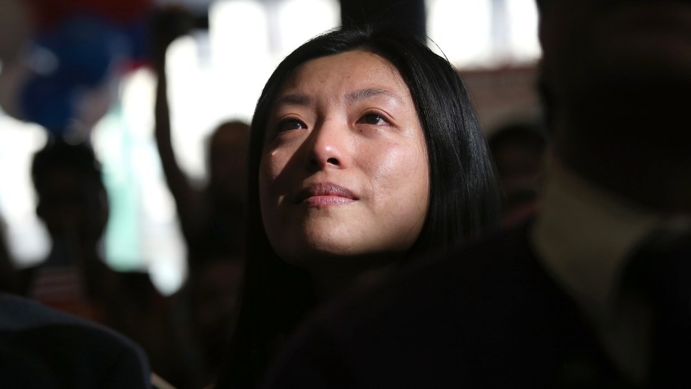 Chinese immigrant and new American citizen Yi Shu sheds a tear after taking the oath of citizenship at a naturalization ceremony on April 9, 2013 in New York City.