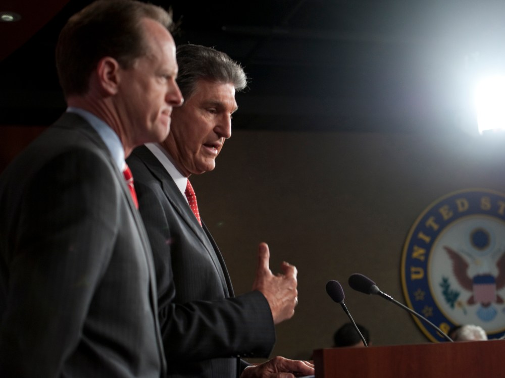 Sen. Pat Toomey, R-Pa., and Sen. Joe Manchin, D-W.V., speak at a press conference about their bi-partisan agreement to propose legislation to strengthen background checks to prevent criminals and those with mental illness from buying guns on April 10,...