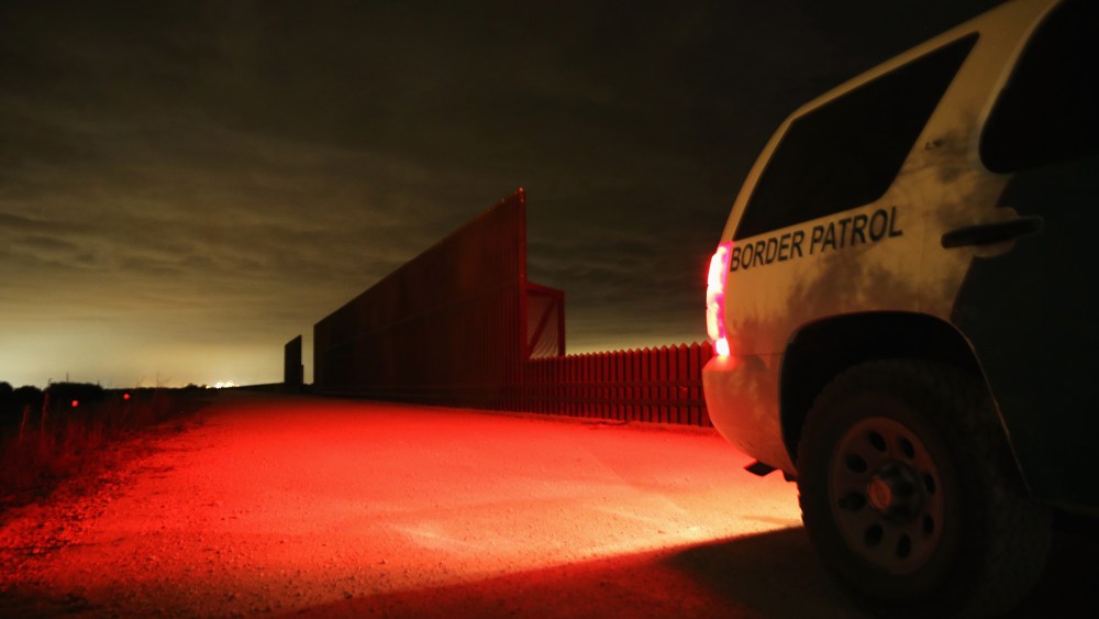 A U.S. Border Patrol vehicle stops near a section of the U.S.- Mexico border fence on April 10, 2013 in La Joya, Texas.