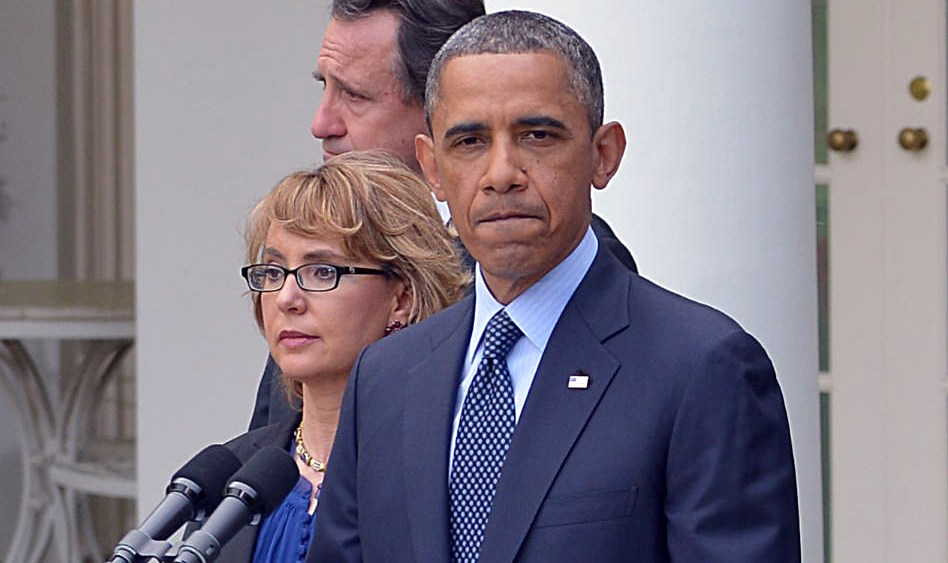 US President Barack Obama, accompanied by former lawmaker Gabrielle Giffords (L),  speaks on gun control and the vote at the US Senate on April 17, 2013, in the Rose Garden of the White House (Photo by Mandel Ngan/AFP/Getty Images)