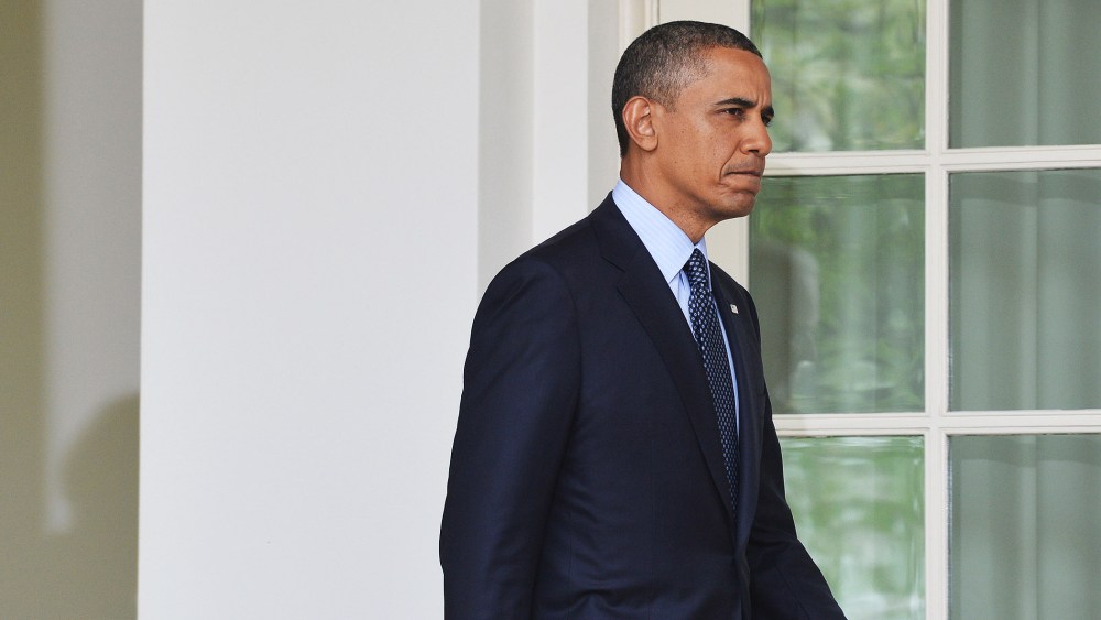 US President Barack Obama is followed by Vice President Joe Biden as they walk out of the Oval Office to speak on gun control at the Rose Garden of the White House in Washington, DC, on April 17, 2013.