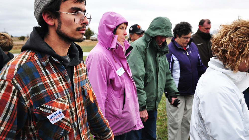 People opposed to the Keystone XL pipeline gather in prayer in Fullerton, Nebraska, April 17, 2013.
