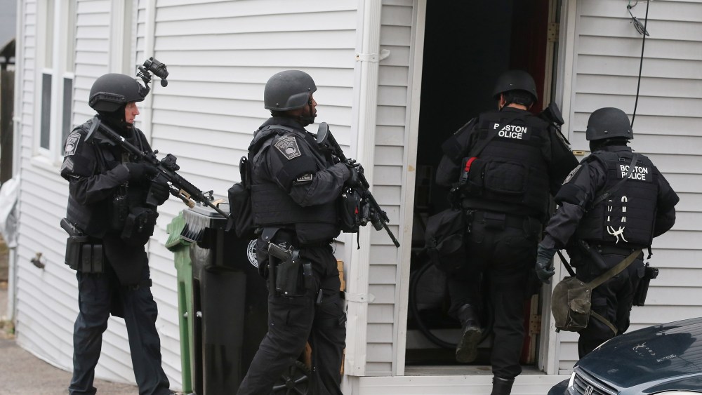 SWAT team members search for the second suspect at a residential building on April 19, 2013 in Watertown, Massachusetts. (Photo by Mario Tama/Getty Images)