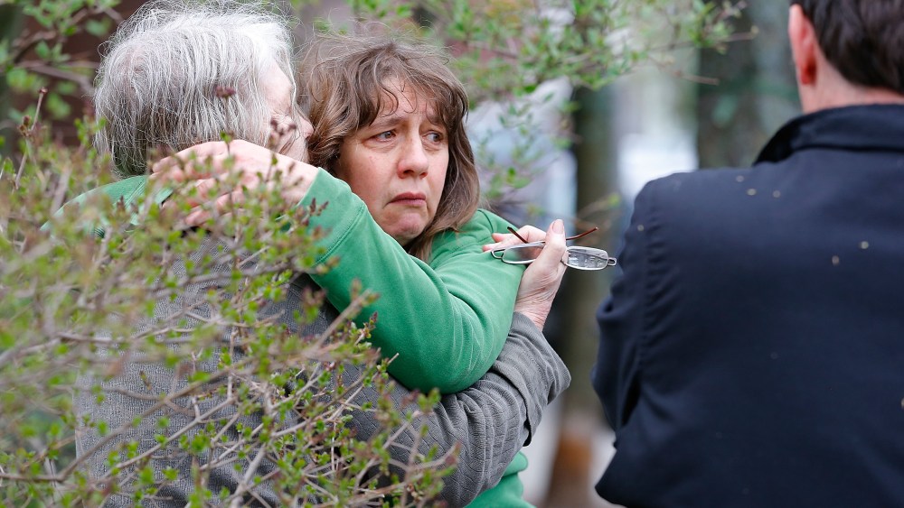 A woman reacts while being questioned by the Cambridge Police and other law enforcement agencies on April 19, 2013, near the home of the Boston bombing suspects in Cambridge, Massachusetts. (Photo by Jared Wickerham/Getty Images)