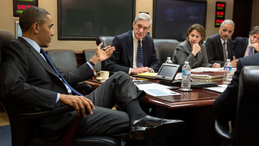 In this handout provided by the White House, U.S. President Barack Obama (L) meets with members of his national security team to discuss developments in the Boston bombings investigation, in the Situation Room of the White House on April 19, 2013 in...