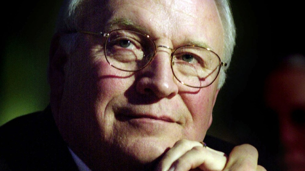 File Photo: U.S. Vice President Dick Cheney listens as former U.S. President George H.W. Bush speaks December 6, 2002 in Washington, D.C. (Photo by Stefan Zaklin/Getty Images, File)