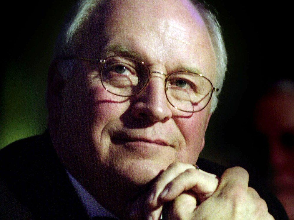 File Photo: U.S. Vice President Dick Cheney listens as former U.S. President George H.W. Bush speaks December 6, 2002 in Washington, D.C. (Photo by Stefan Zaklin/Getty Images, File)