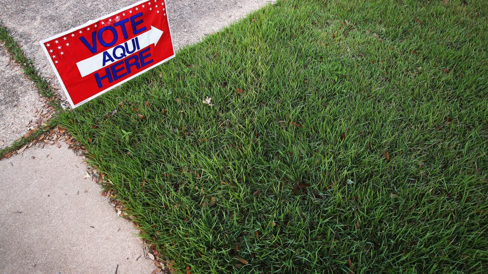 English-Spanish Signs Front Election Center In Texas