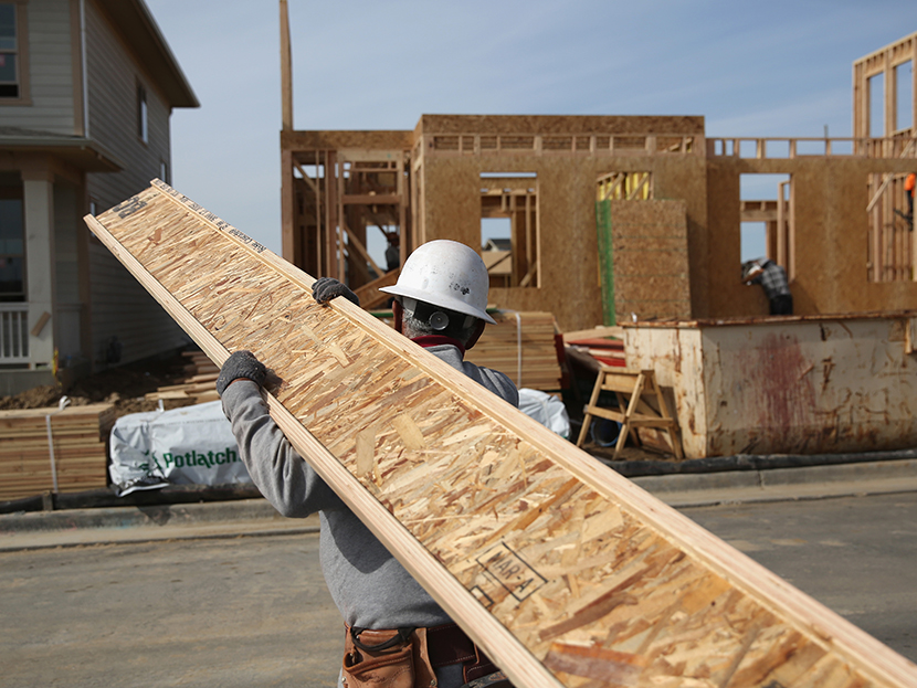 A laborer works at a housing development on May 3, 2013, in Denver, Colo. (Photo by John Moore/Getty Images)
