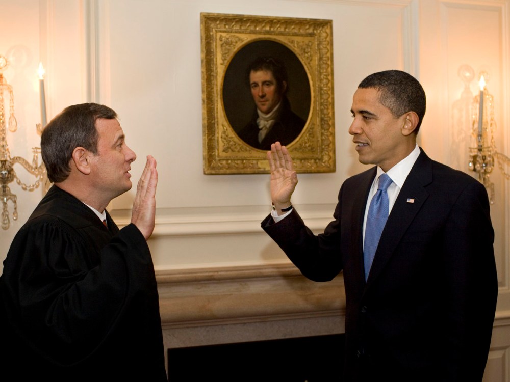 This official White House photograph shows US President Barack Obama (R) retaking the oath of office from Chief Justice John Roberts (L)  January 21, 2009 in the Map Room of the White House in Washington, DC. (Photo by Pete Souza/AFP/Getty Images)