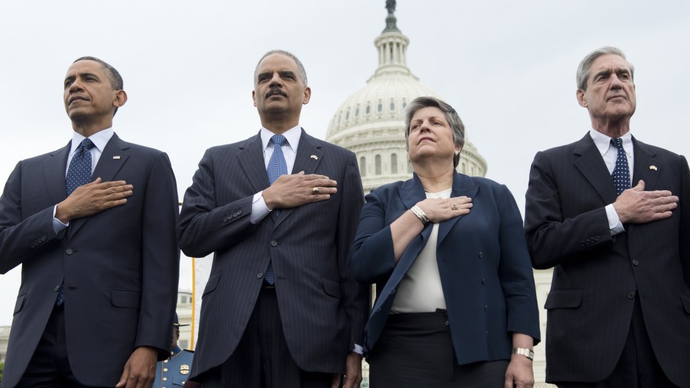 L-R: US President Barack Obama (L), Attorney General Eric Holder, Secretary of Homeland Security Janet Napolitano and Director of the Federal Bureau Investigation (FBI) Robert Mueller stand during the National Anthem at the National Peace Officers...