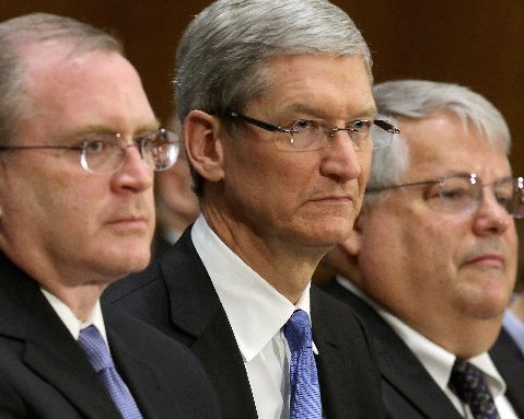 (L-R) Apple head of tax operations Phillip Bullock, Apple CEO Timothy Cook and Apple Senior Vice President and CFO Peter Oppenheimer prepare to testify before the Senate Homeland Security and Governmental Affairs Committee's Investigations Subcommittee...