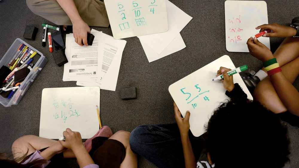 A teacher goes over fractions with her students in fourth grade math class at Piney Branch Elementary School in Takoma Park, Md. on May 16, 2013.
