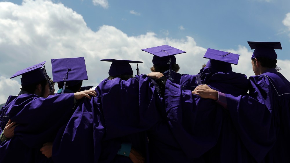 Students pose for photos before Arvada West High Schools graduation ceremony at the Coors Events Center on the Campus of the University of Colorado on May 22, 2013 in Boulder, Colorado.