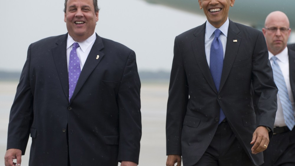 US President Barack Obama walks with New Jersey Governor Chris Christie (L) after arriving at Joint Base McGuire-Dix in New Jersey on May 28, 2013. Obama is traveling to the New Jersey shore to view rebuilding efforts following last year's Hurricane...