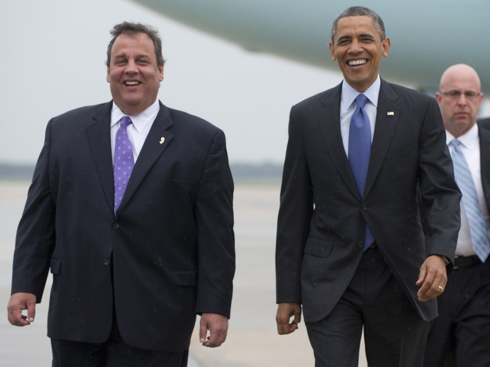 US President Barack Obama walks with New Jersey Governor Chris Christie (L) after arriving at Joint Base McGuire-Dix in New Jersey on May 28, 2013. Obama is traveling to the New Jersey shore to view rebuilding efforts following last year's Hurricane...