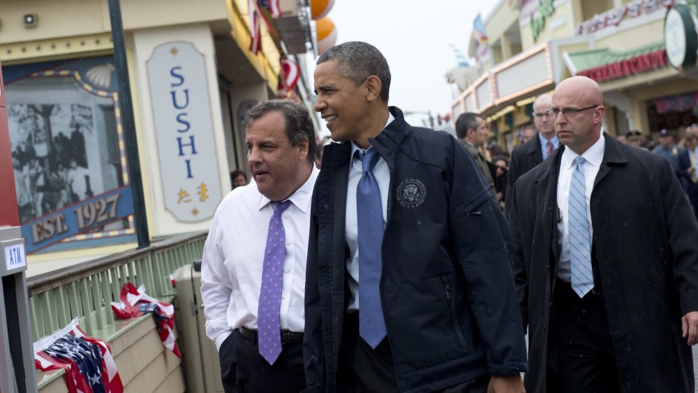 US President Barack Obama and New Jersey Governor Chris Christie (L) walk along the boardwalk as they view rebuilding efforts following last year's Hurricane Sandy in Point Pleasant, New Jersey, on May 28, 2013. (Photo by Saul Loeb/AFP/Getty Images)