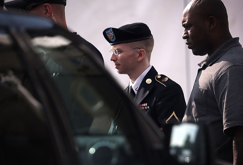 U.S. Army Private First Class Bradley Manning (C) is escorted as he leaves a military court for the day June 3, 2013 at Fort Meade in Maryland.  (Photo by Alex Wong/Getty Images)