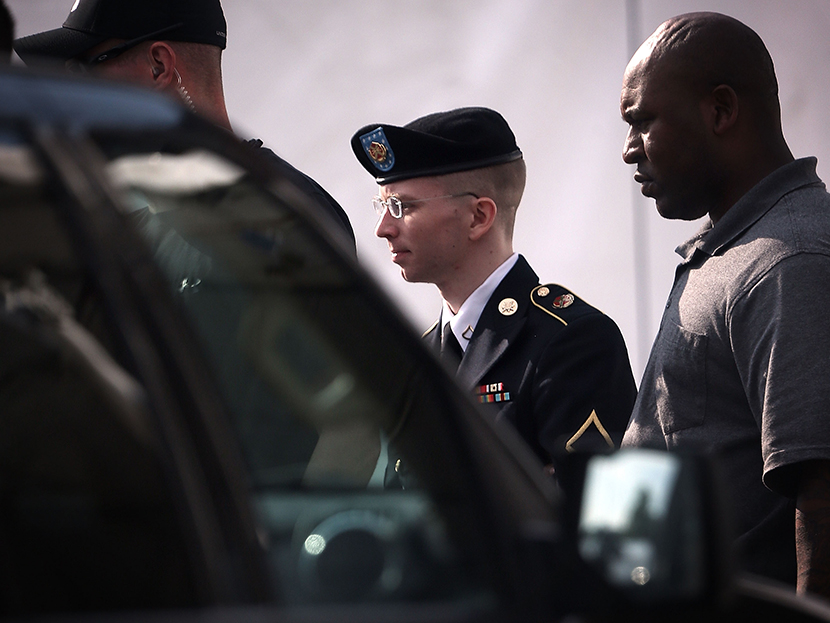 U.S. Army Private First Class Bradley Manning (C) is escorted as he leaves a military court for the day June 3, 2013 at Fort Meade in Maryland. (Photo by Alex Wong/Getty Images)
