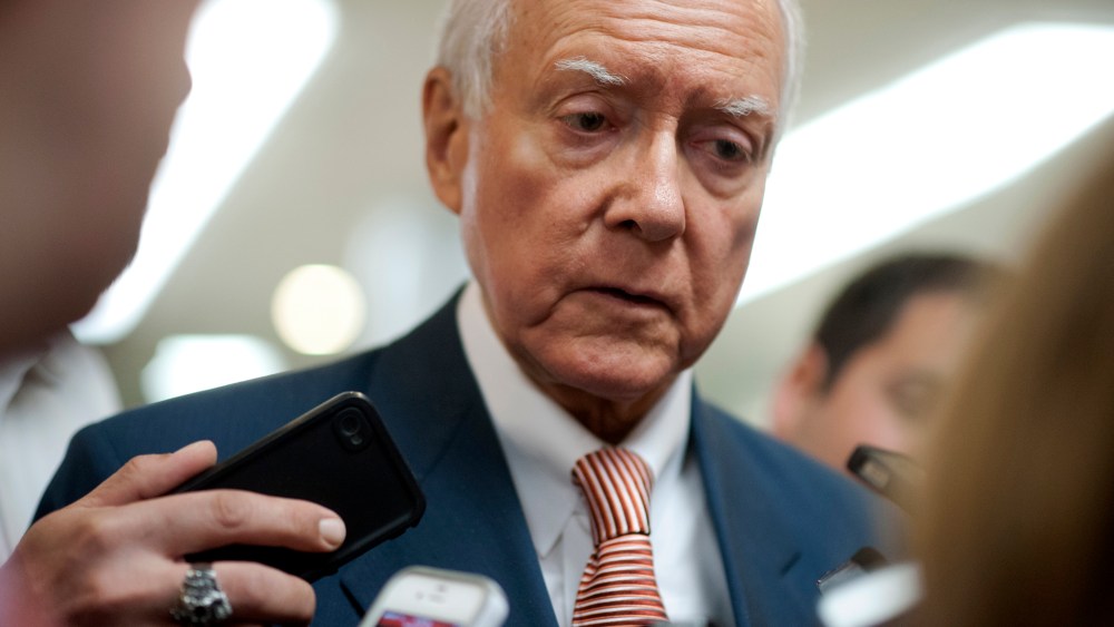 Sen. Orrin Hatch, R-UT., talks to reporters as he walks to the weekly Senate policy luncheons in the U.S. Capitol on June 4, 2013.