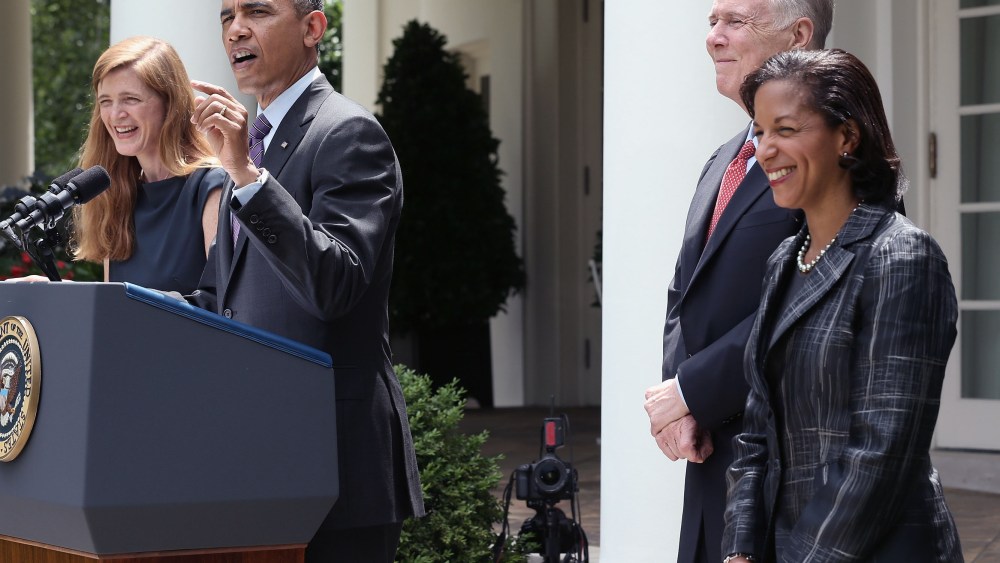 U.S. President Barack Obama speaks as former aide Samantha Power (L), U.S. Ambassador to the United Nations Susan Rice (R) and incumbent National Security Adviser Tom Donilon (2L) listen during a personnel announcement at the Rose Garden of the White...