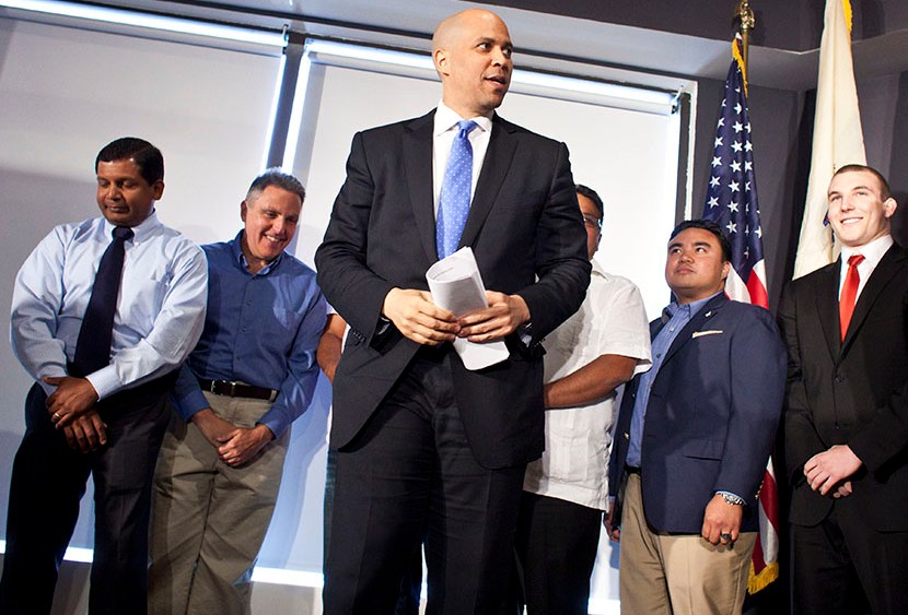 Newark Mayor Cory Booker steps on a stage during a news conference to discuss his plans to campaign for the Democratic nomination to run for the seat of late U.S. Sen. Frank Lautenberg on June 8, 2013 in Newark, New Jersey. (Photo by Ramin Talaie/Getty)