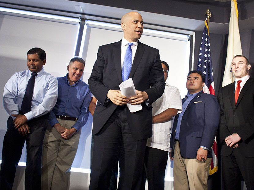 Newark Mayor Cory Booker steps on a stage during a news conference to discuss his plans to campaign for the Democratic nomination to run for the seat of late U.S. Sen. Frank Lautenberg on June 8, 2013 in Newark, New Jersey. (Photo by Ramin Talaie/Getty)