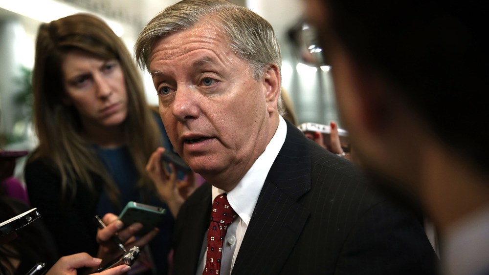 Sen. Lindsey Graham (R-SC) speaks to reporters prior to a Republican Policy Luncheon June 11, 2013 on Capitol Hill in Washington, D.C.