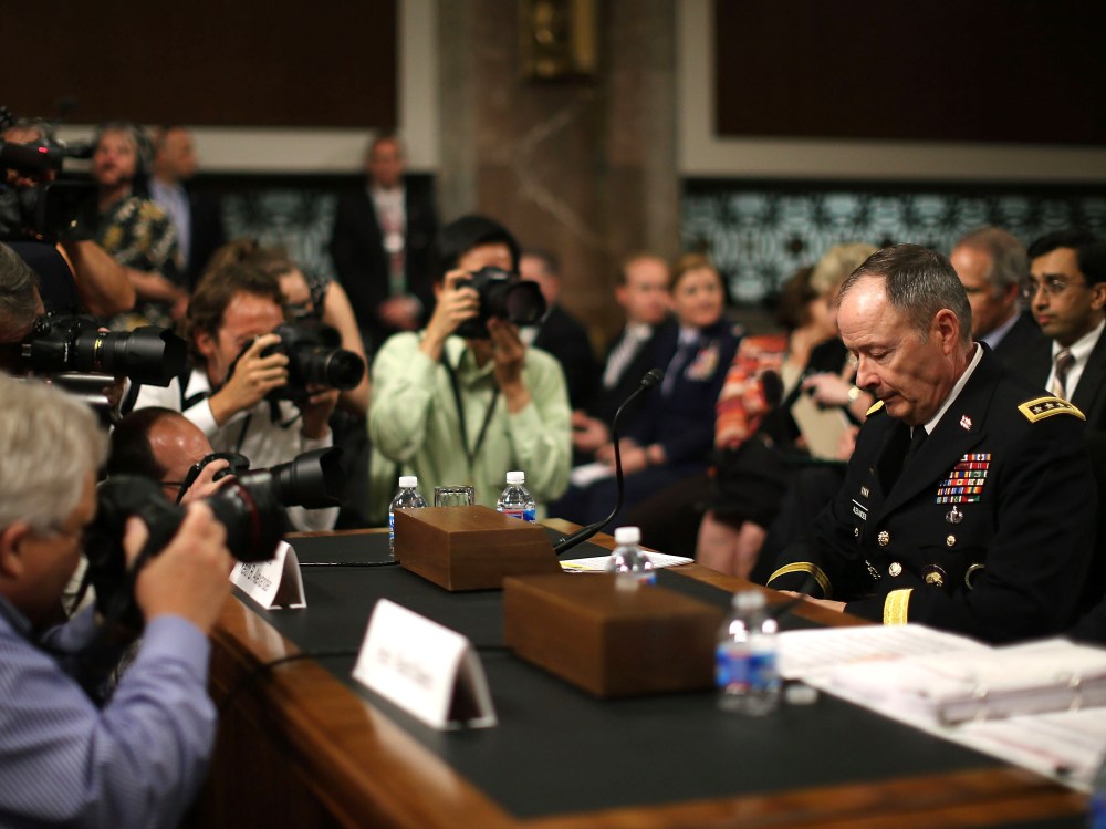 File photo: Army Gen. Keith Alexander, director of the National Security Agency (NSA) is surrounded by photographers after arriving at a Senate Appropriations Committee hearing June 12, 2013.  (Photo by Mark Wilson/Getty Images)