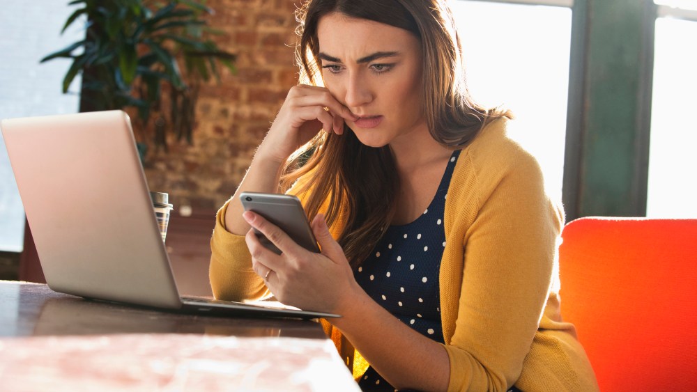 Image: Stressed woman using cell phone