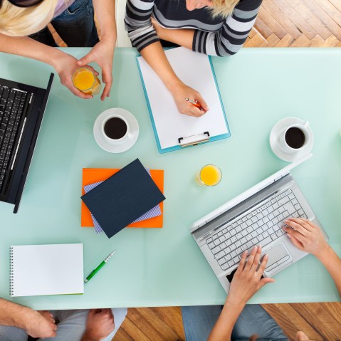Image: Group of people with two laptops at a meeting