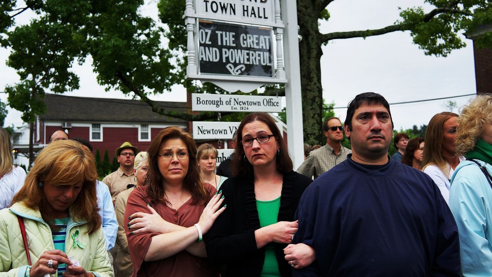 People attend a remembrance event on the six month anniversary of the massacre at Sandy Hook Elementary School on June 14, 2013 in Newtown, Connecticut.