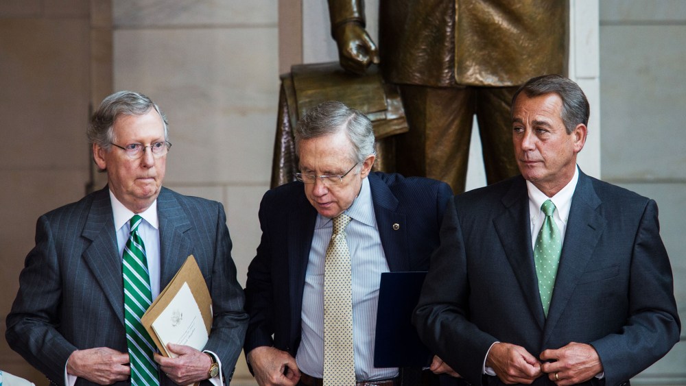 Mitch McConnell, Harry Reid, and John Boehner prepare to take their seats for a dedication ceremony at the U.S. Capitol, June 19, 2013.