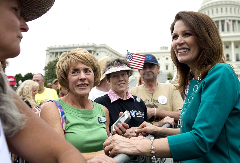 Minnesota Republican Representative Michele Bachmann greets demonstrators with the Tea Party during a protest against the Internal Revenue Service (IRS) targeting of the Tea Party and similar groups outside the US Capitol in Washington, DC, June 19,...