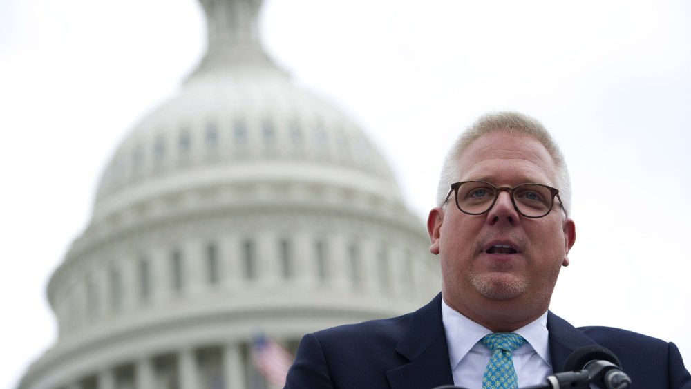 Conservative radio and television commentator Glenn Beck speaks to a rally of Tea Party members as they protest against the Internal Revenue Service (IRS) targeting of the Tea Party and similar groups, June 19, 2013. (Photo by Saul Loeb/AFP/Getty)