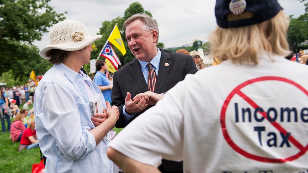 Rep. Steve Stockman speaks with supporters during a Tea Party Patriots rally on the west front of the Capitol, June 19, 2013.