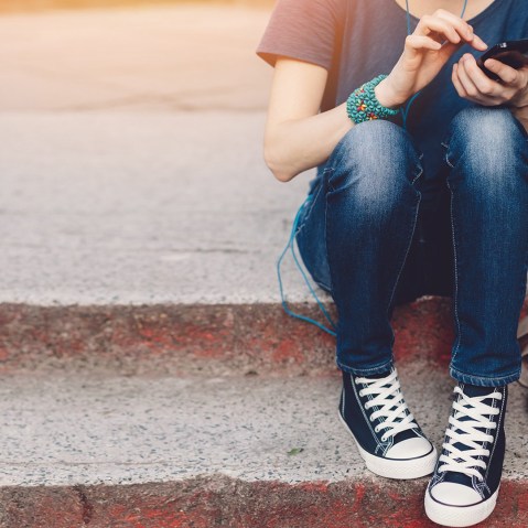 Image: Girl looking on phone